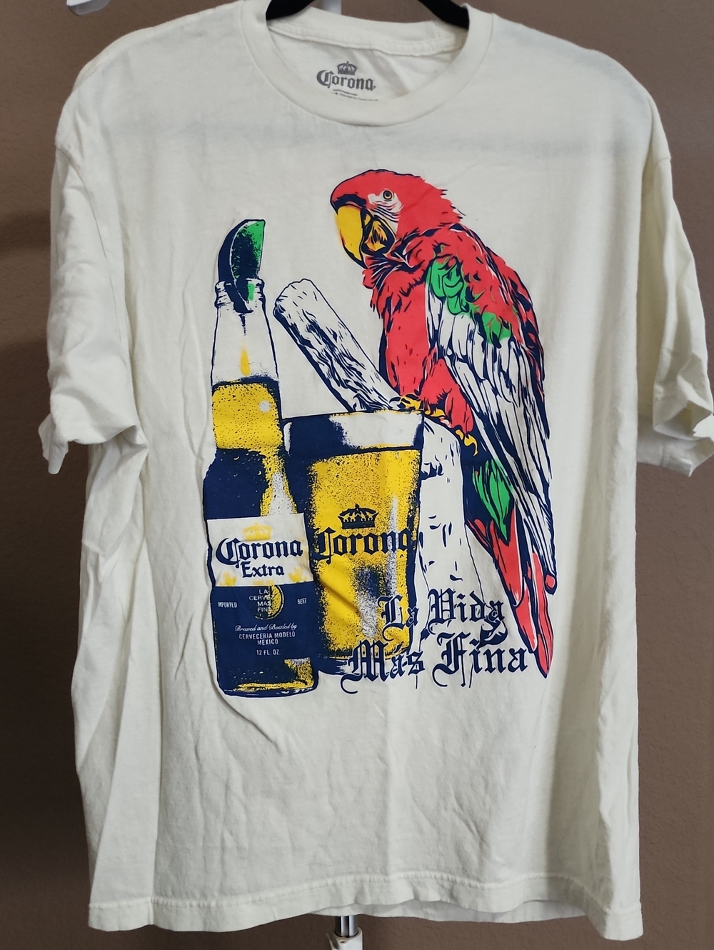 Corona Cream T-Shirt with Red & Green Parrot Graphic